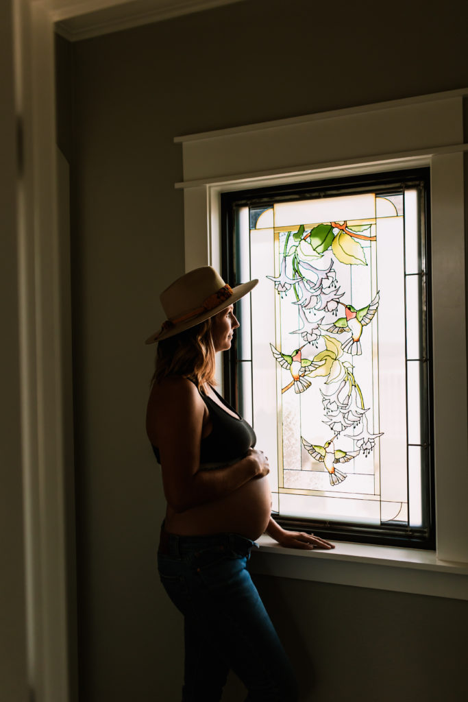 maternity photo by stained glass window