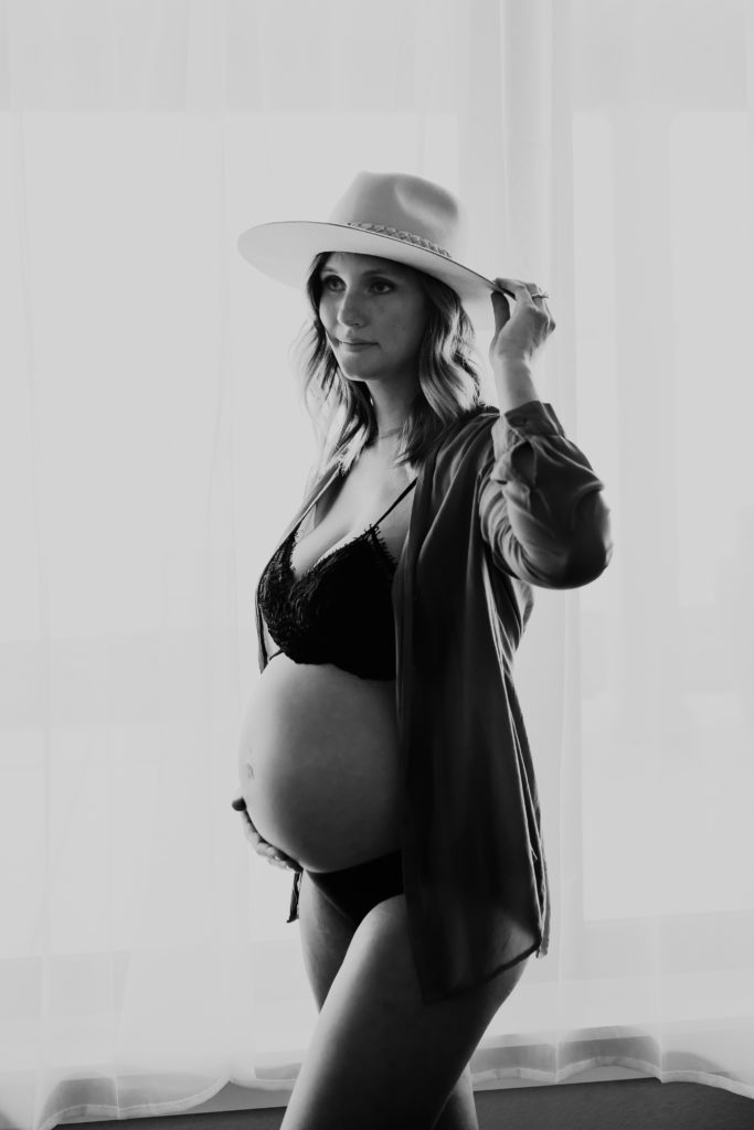 black and white maternity photo by window