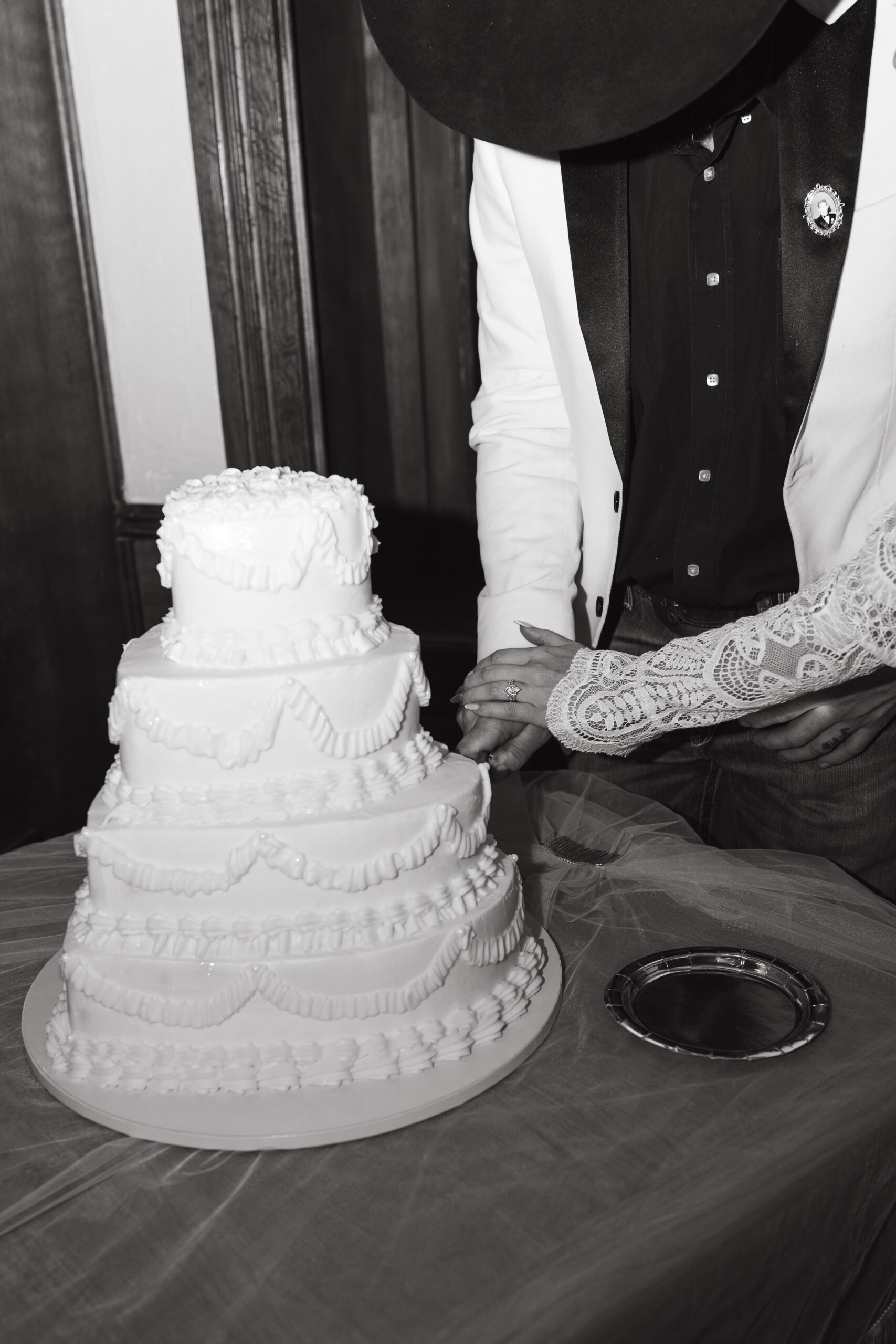 Bride and groom cutting their vintage cake at Hotel Ecklund, Clayon New Mexico. 