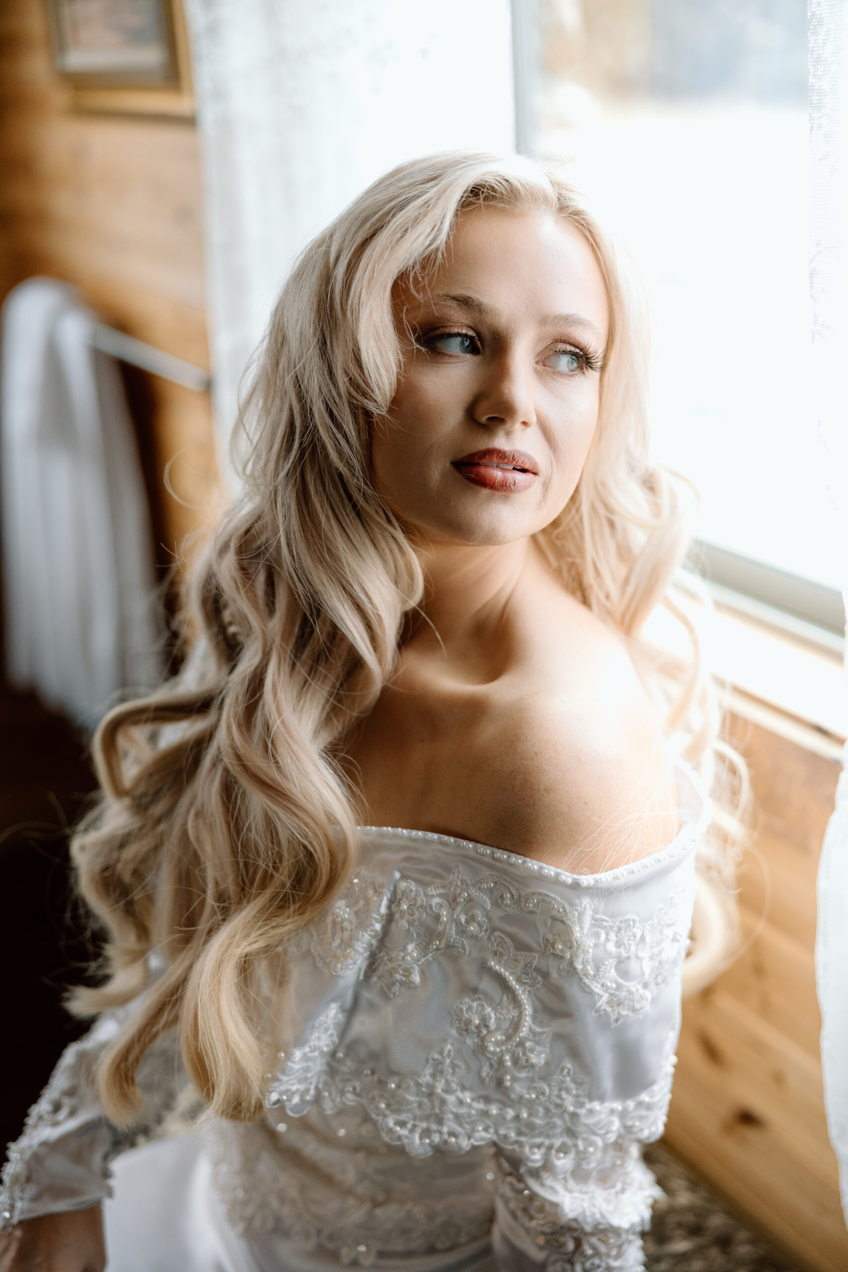 Bride in a vintage-style Western wedding dress at The Hideout cabin near Palo Duro Canyon.