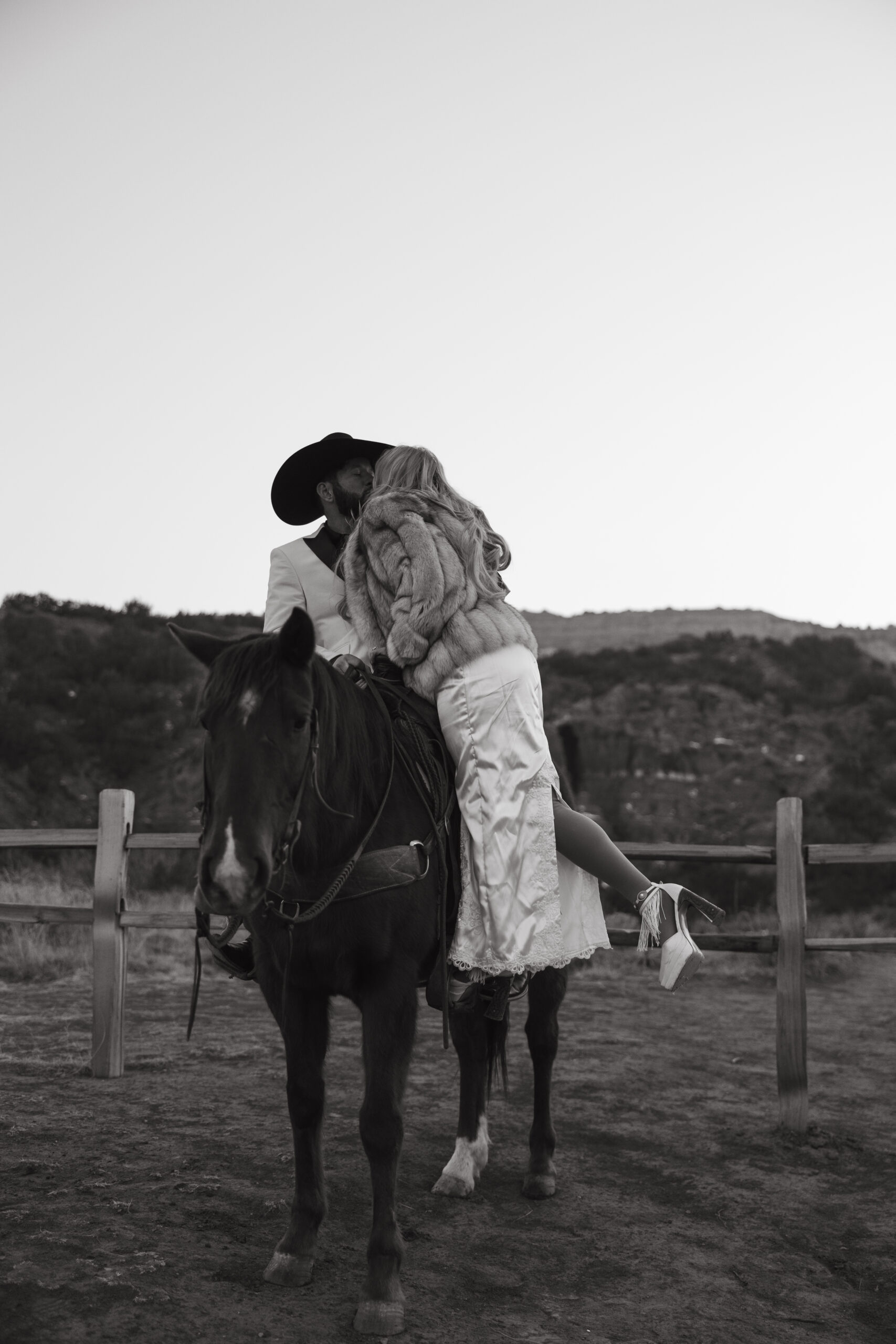 Western elopement couple with horses in Palo Duro Canyon for an adventurous Texas elopement.