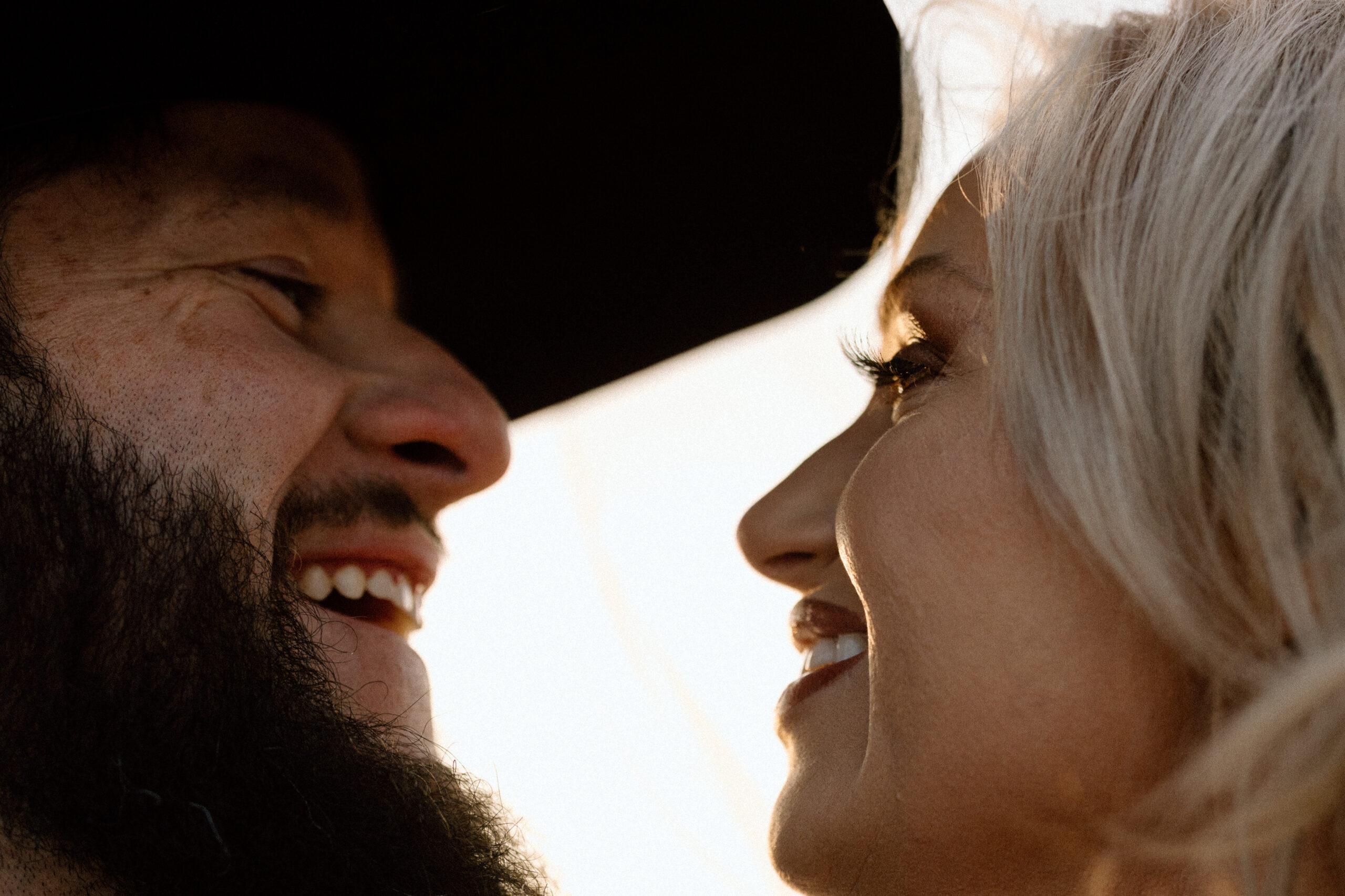 Close-up of a bride and groom kissing, Western wedding style.