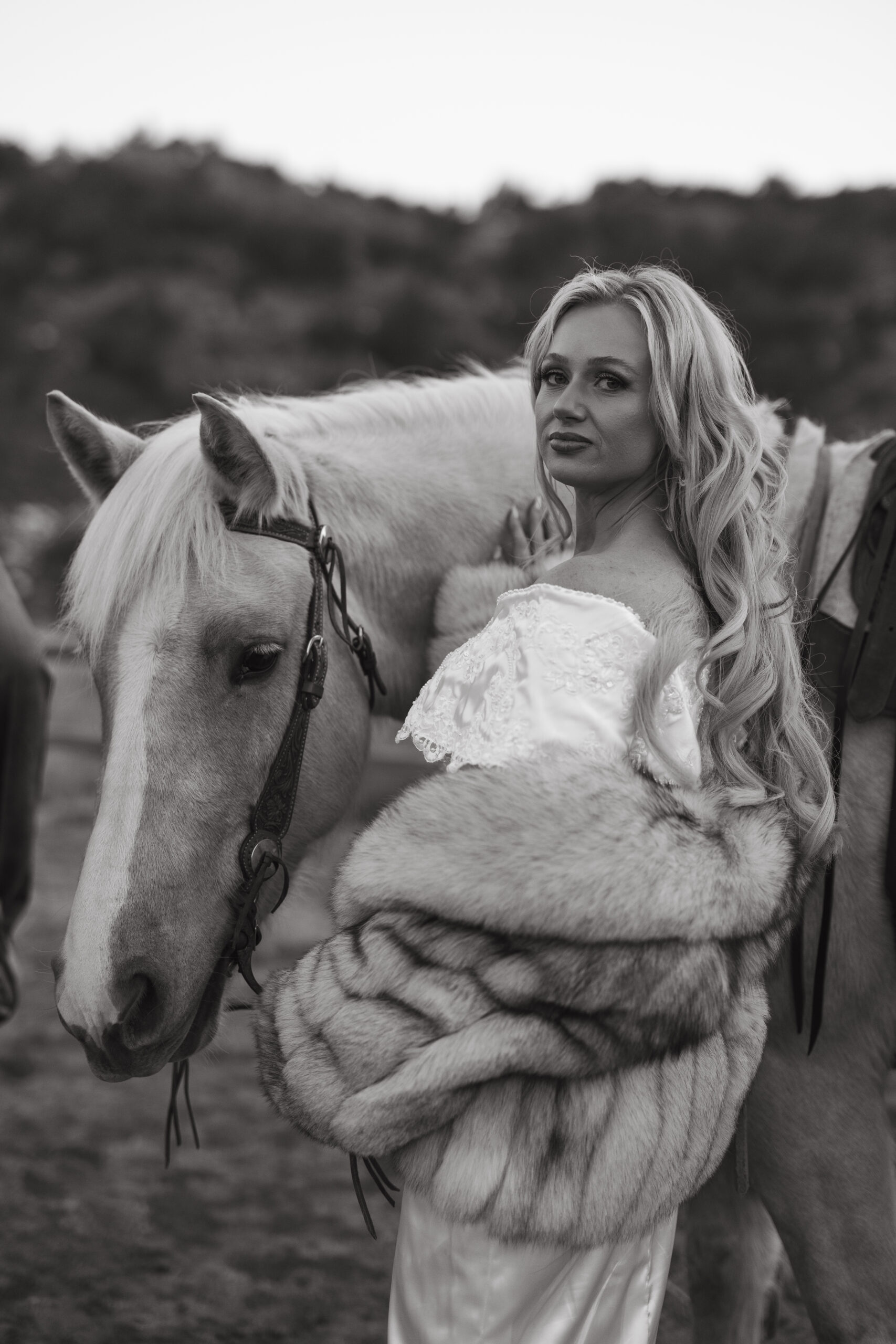 Western bride with horses in Palo Duro Canyon for an adventurous Texas elopement. 
