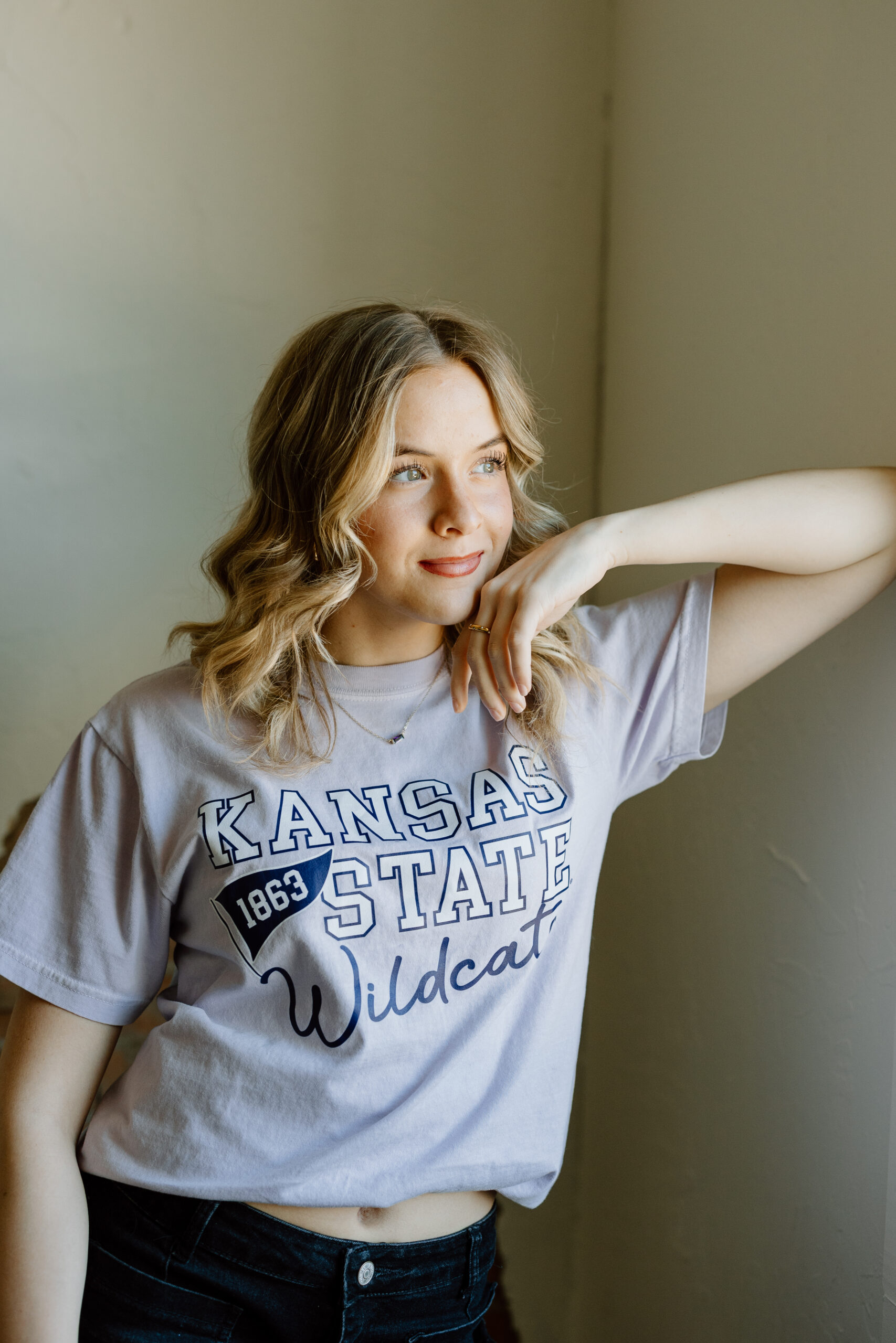 Natural light studio senior portraits in Canyon, Texas, using minimalist backdrops to create a clean and modern look for Texas Panhandle senior portraits.