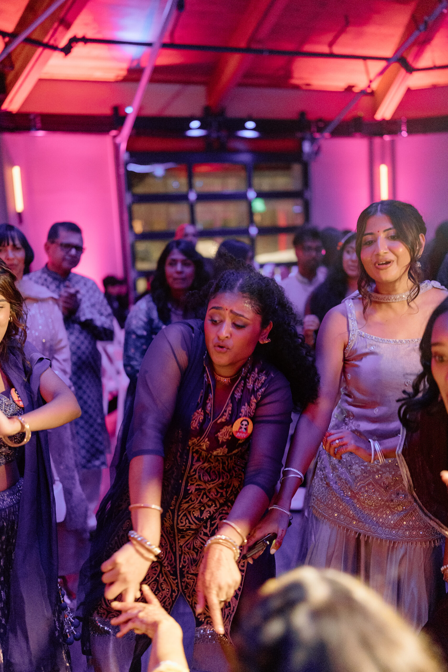 Electric, high-motion dance floor photography using ambient light at a Colorado wedding.