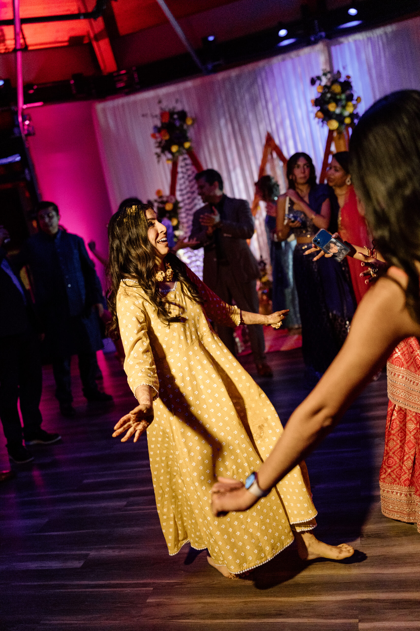 Electric, high-motion dance floor photography using ambient light at a Colorado wedding.