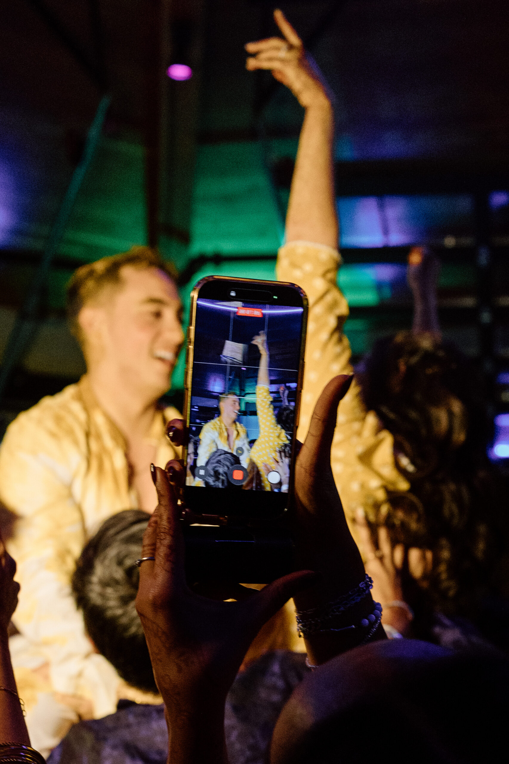 Electric, high-motion dance floor photography using ambient light at a Colorado wedding.