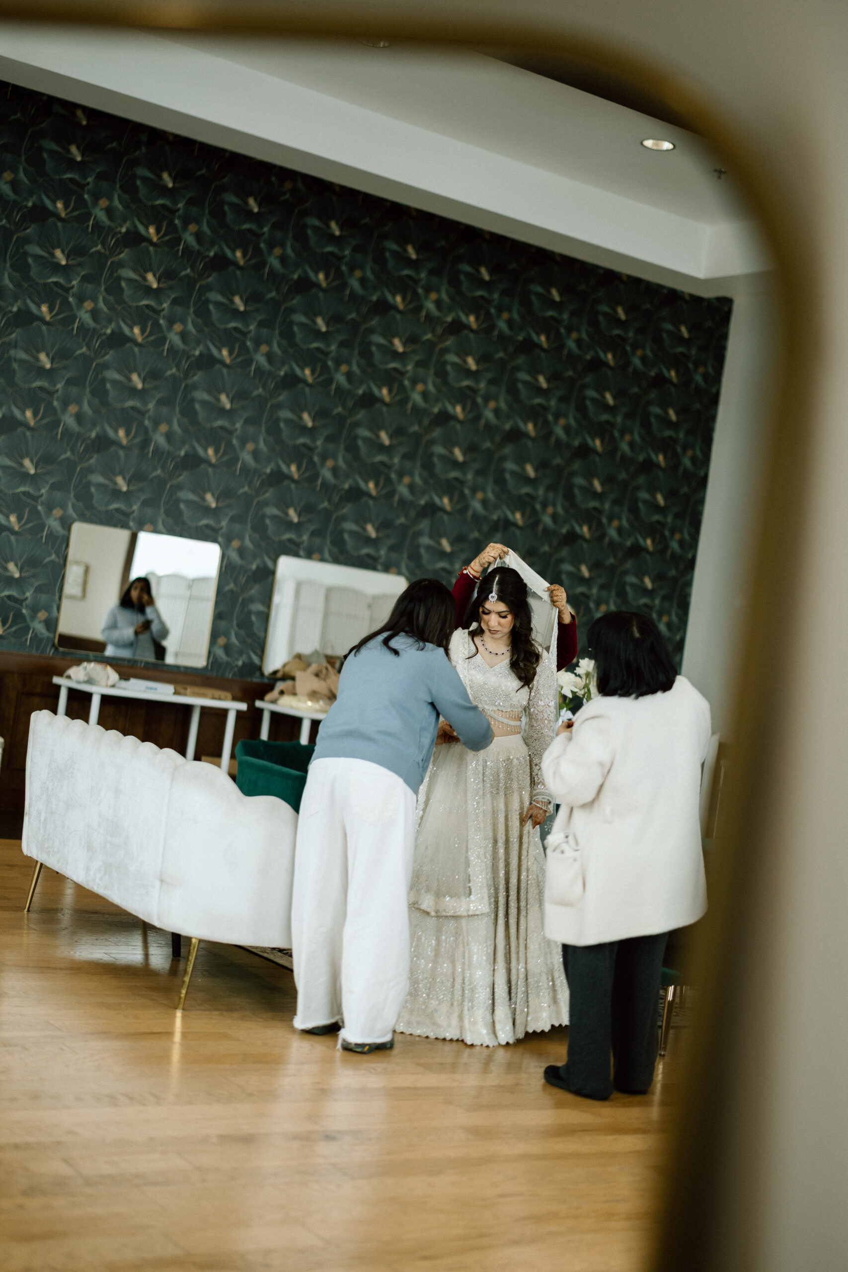 Second shooter perspective of a bride's outfit change in Colorado.