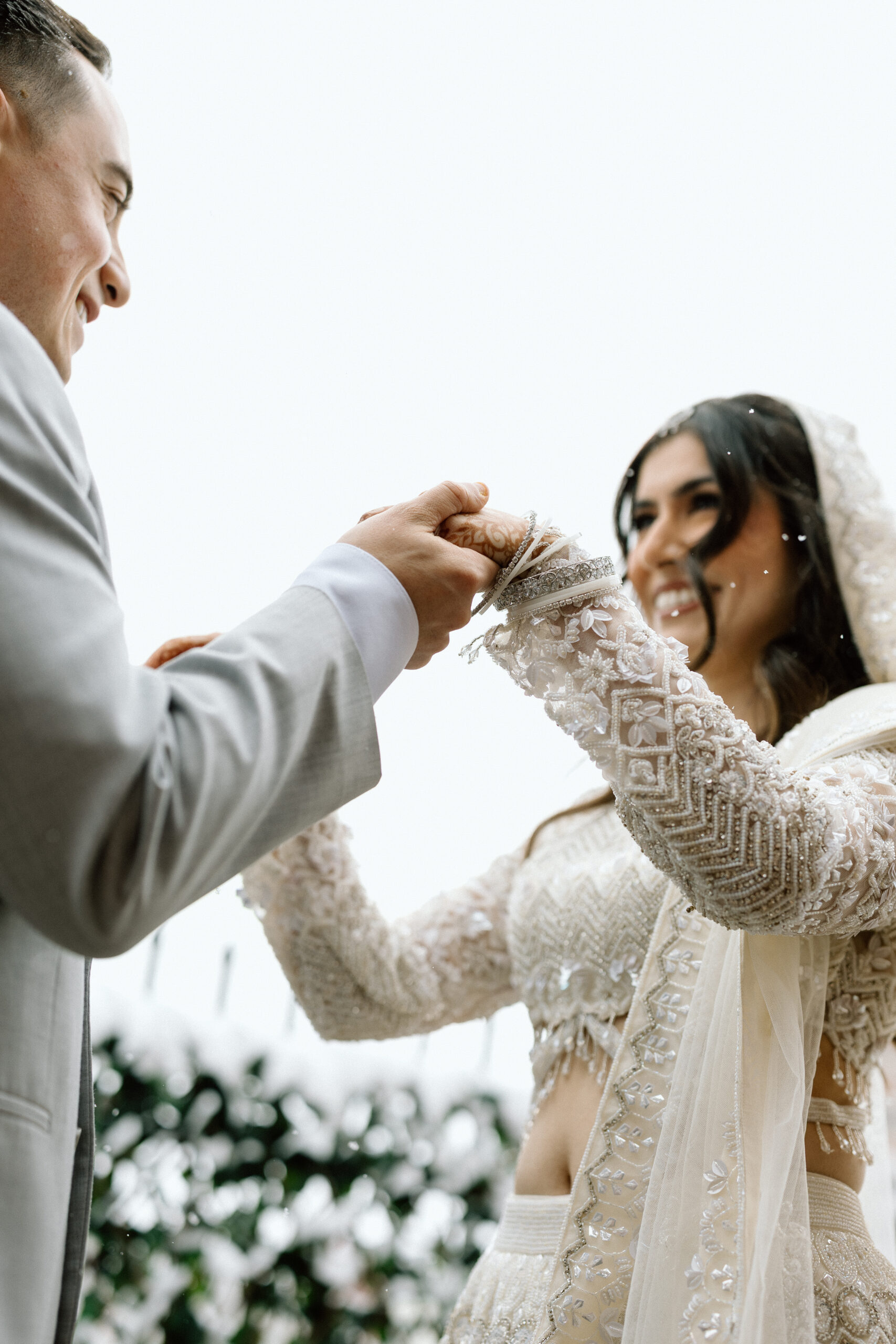 Tight detail shot of a bride and groom in the Denver snow.