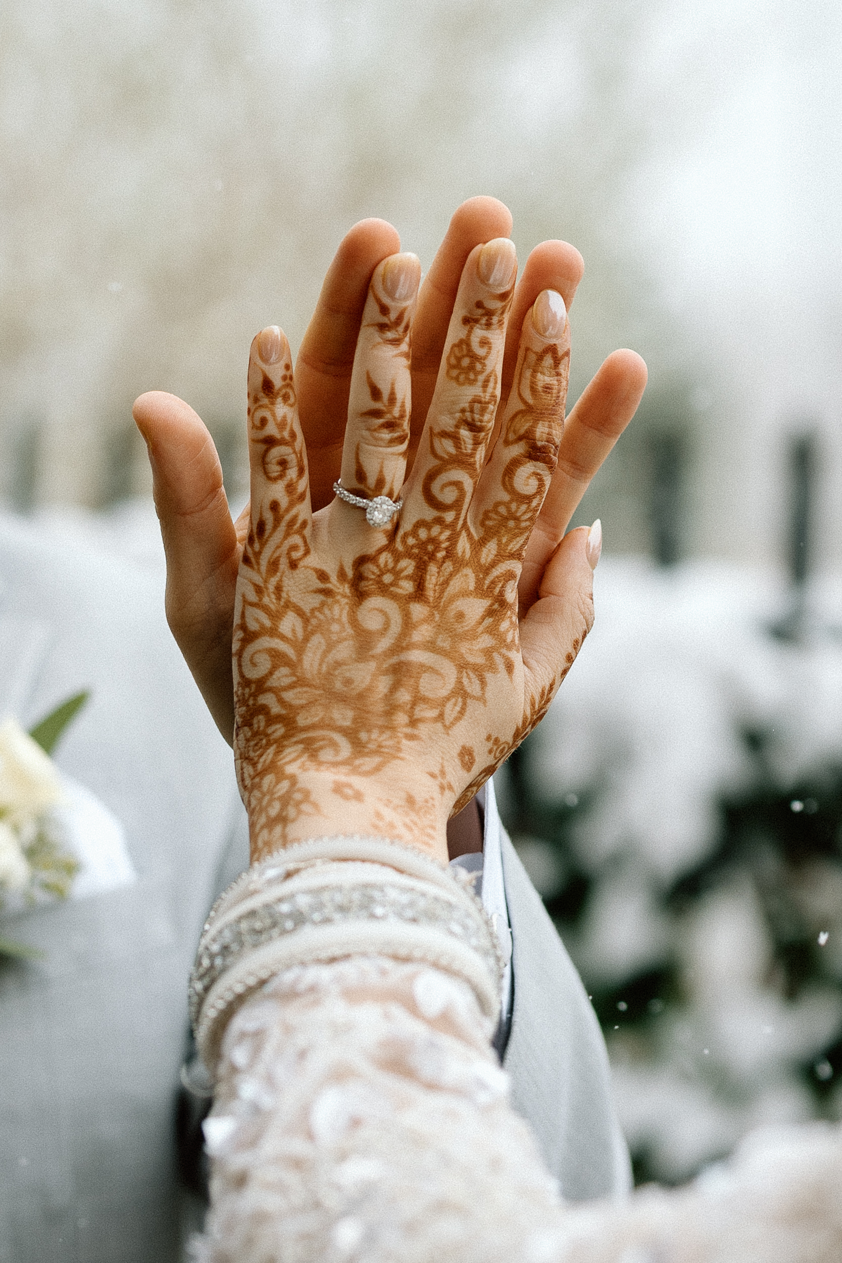 Tight detail shot of a bride and groom in the Denver snow.