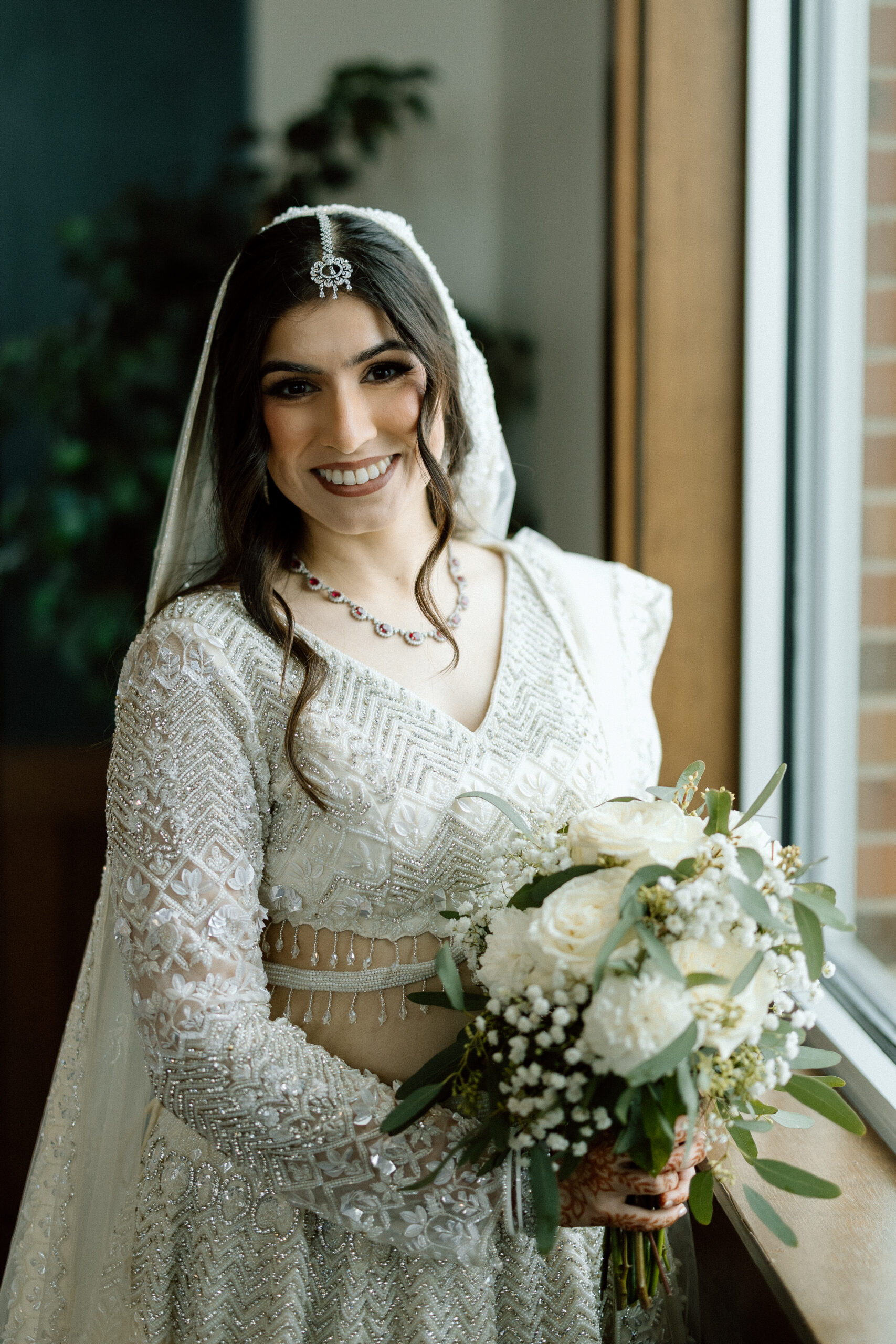 Bride in a silvery champagne wedding dress for a Denver celebration.