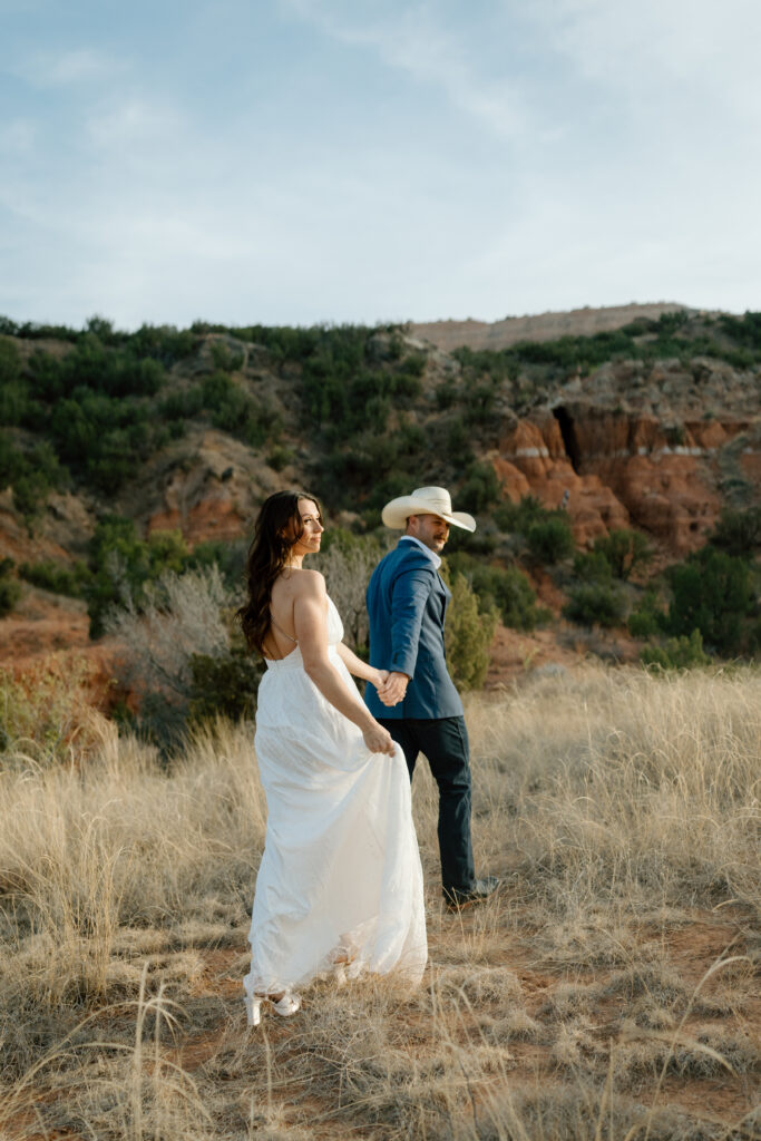 Classic engagement portraits with rich sunset tones in Palo Duro Canyon