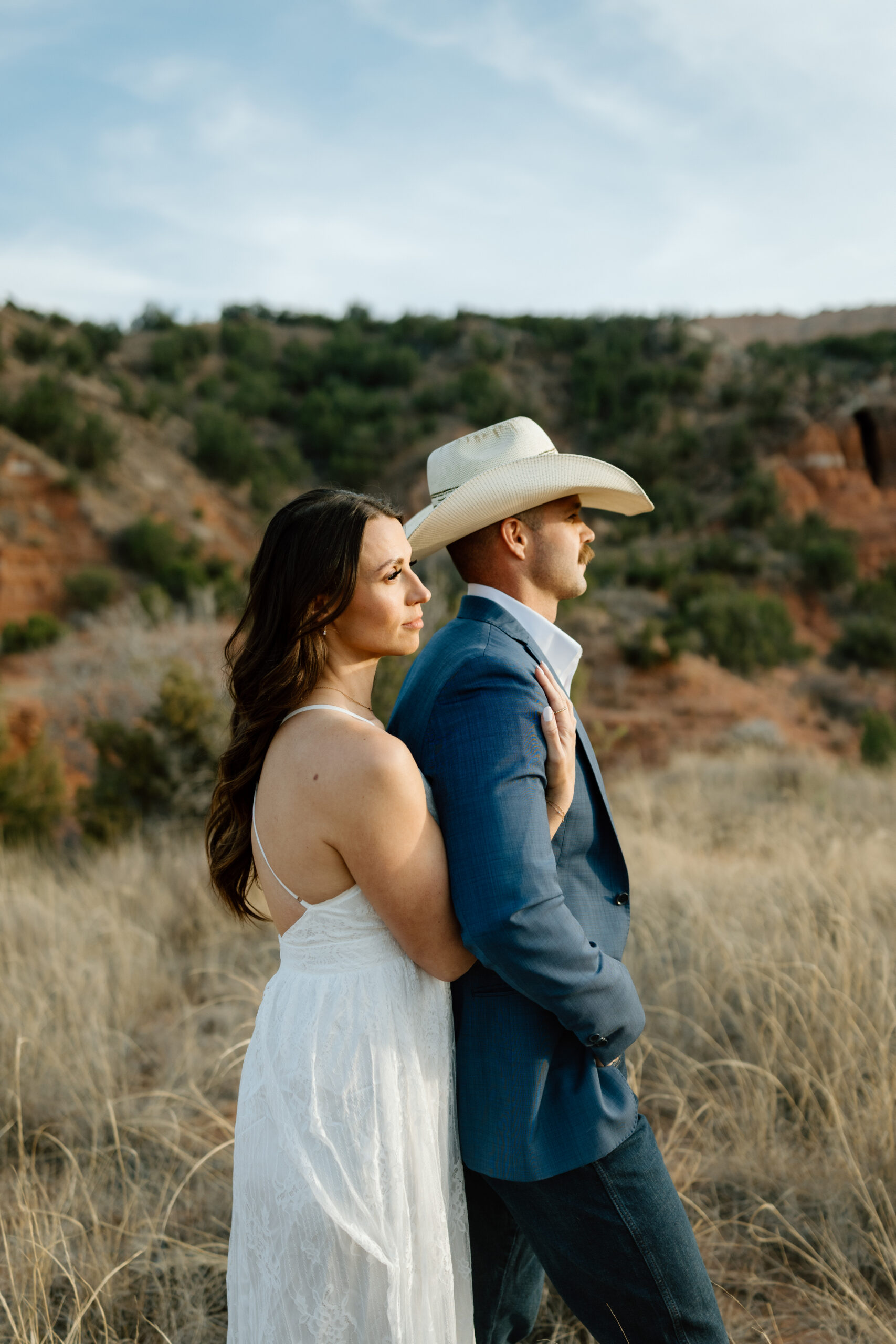 Classic engagement portraits with rich sunset tones in Palo Duro Canyon