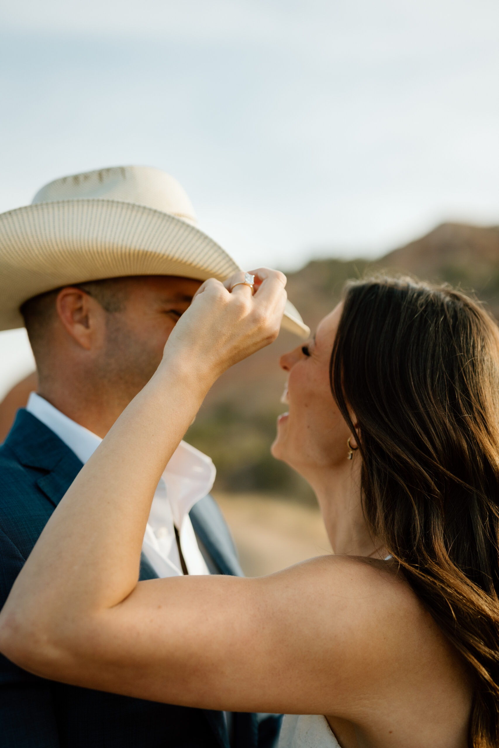 Candid wedding photography in Palo Duro Canyon with dramatic red rock backdrop